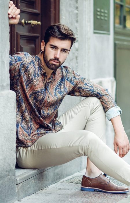 young-bearded-man-model-of-fashion-sitting-in-an-urban-step-2